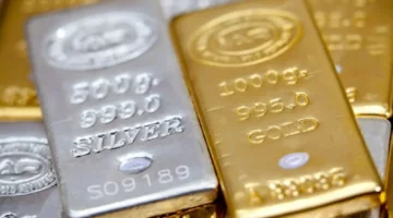 الذهب ينخفض مع خفض الفائدة الأمريكية وارتفاع قياسي للفضة